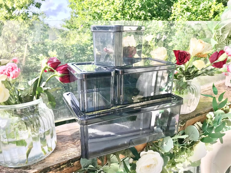Good quality. Set of 4 Black tint plastic storage boxes Only used a few times