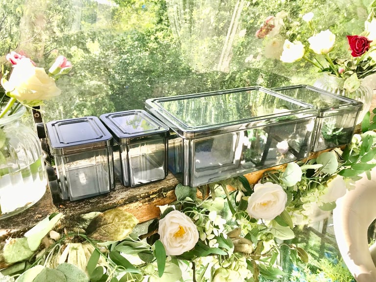 Good quality. Set of 4 Black tint plastic storage boxes Only used a few times