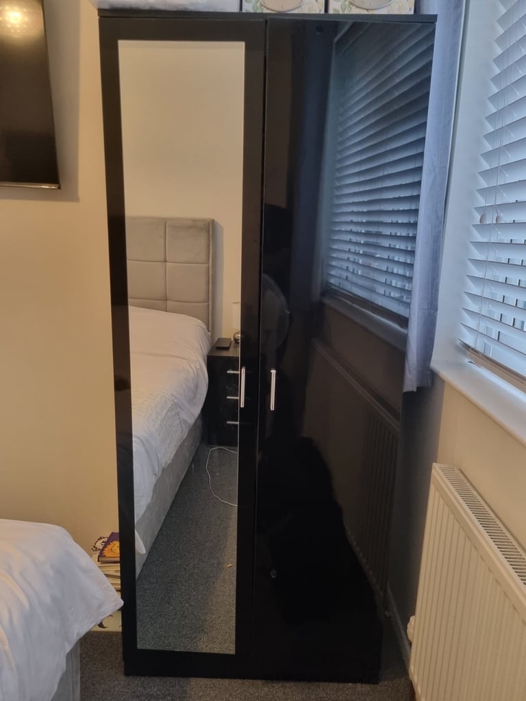 Black wardrobe with mirror