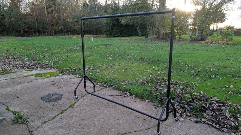 image for Metal clothing rack with wheels 