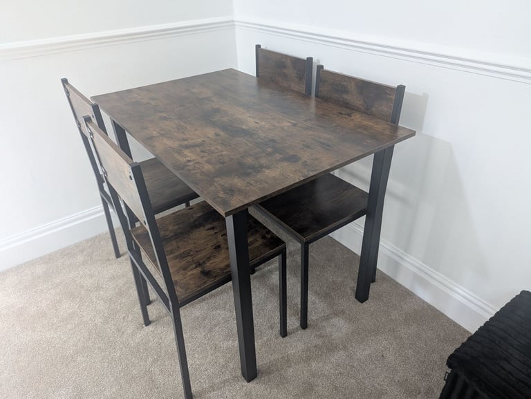 image for Table and chairs set never used 