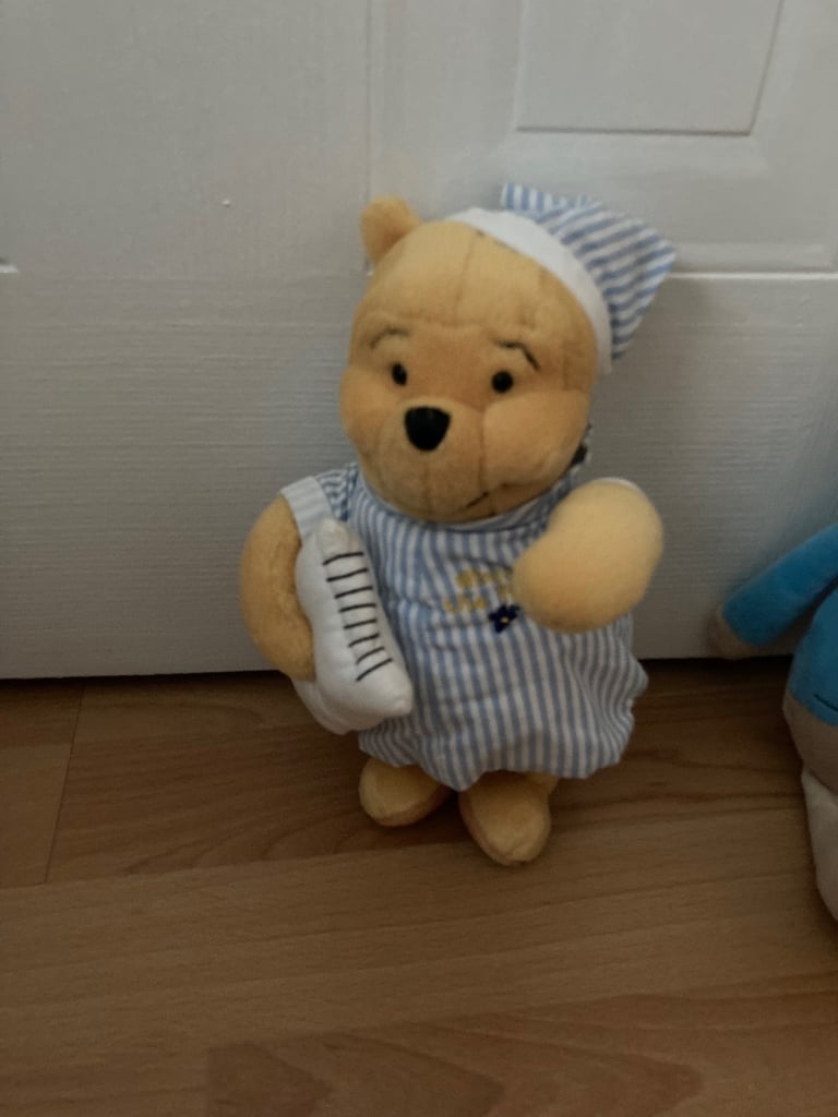 Selection of soft toys inc Peter rabbit bunny, giraffe, Winnie the Pooh and animal stacking ring