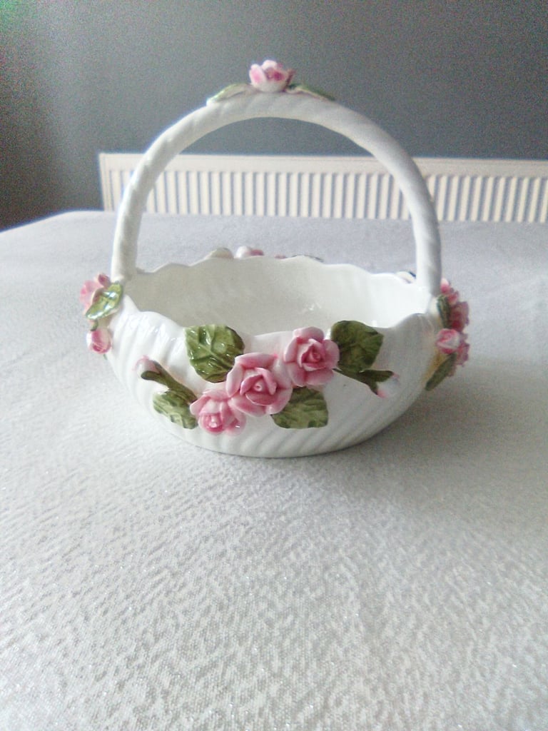 Ornate white ceramic with rose and petal detailing, vase and handled bowl set.