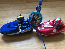 paw patrol earphones and two boats on wheels