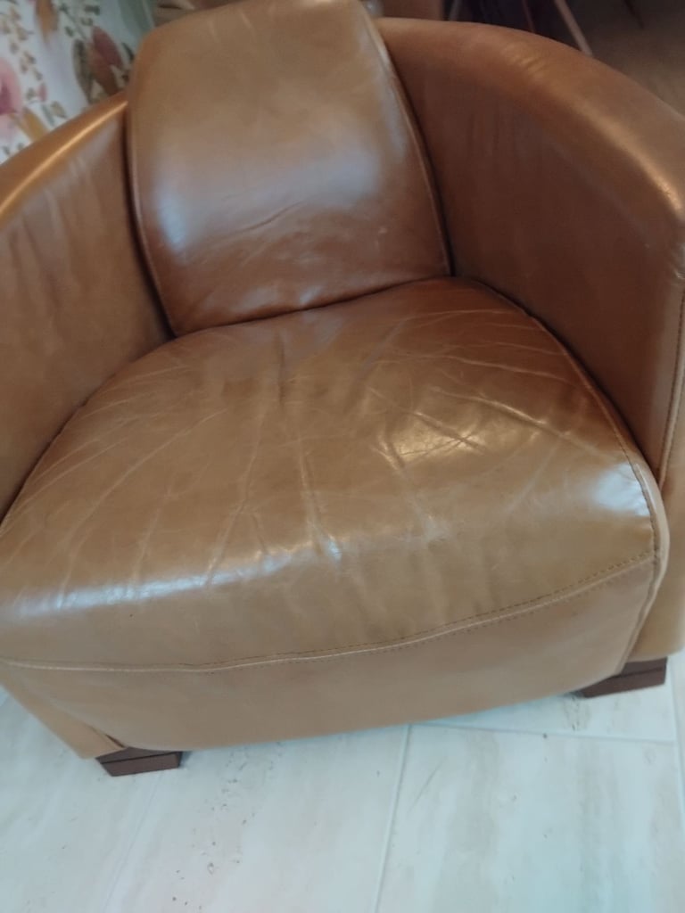 Pair of Halo Rocket/Aviator chairs in Old Saddle Nut leather. Two chairs.