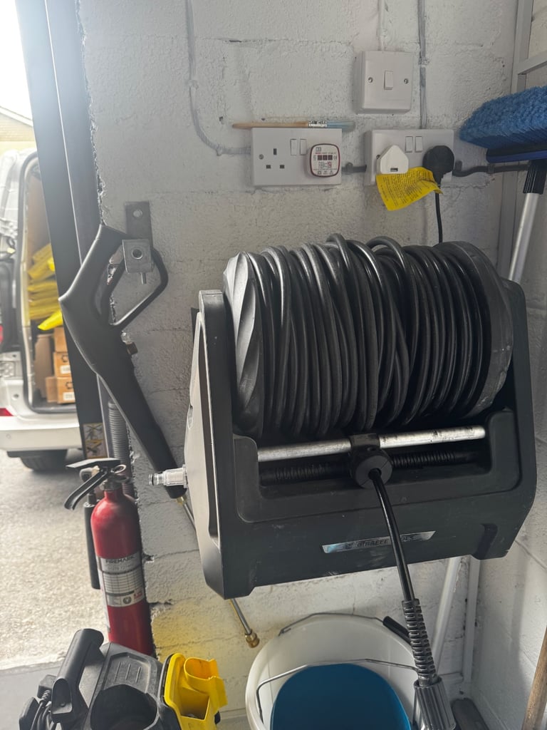 Wall mounted pressure washer 