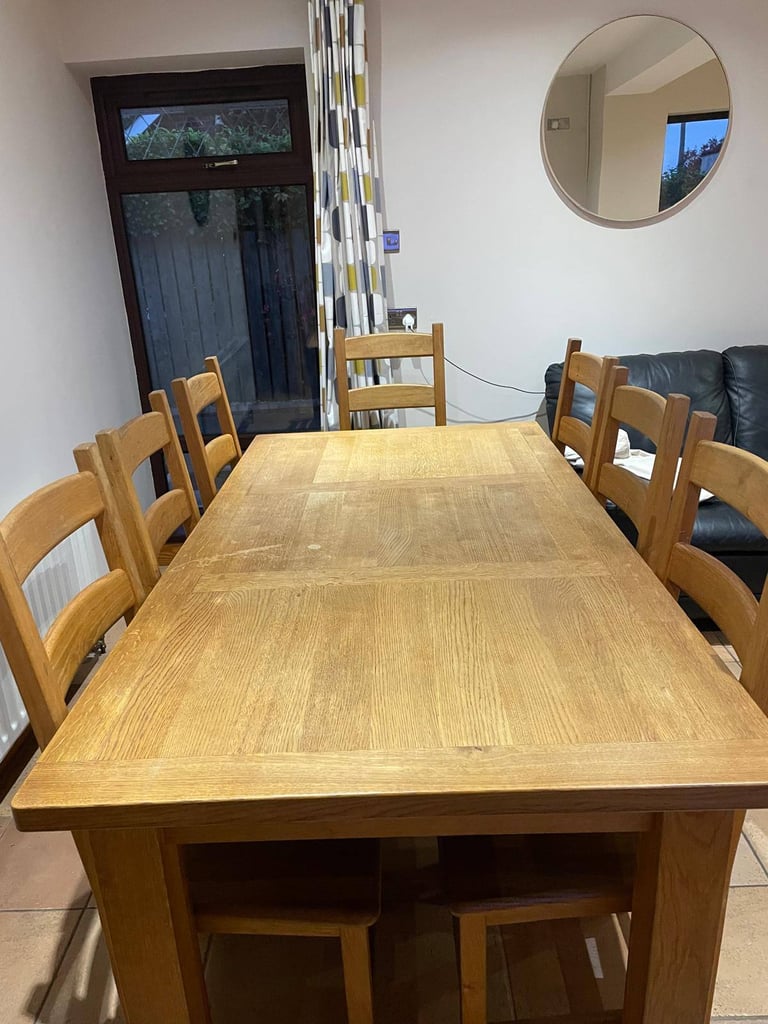 image for Solid oak dining table and chairs