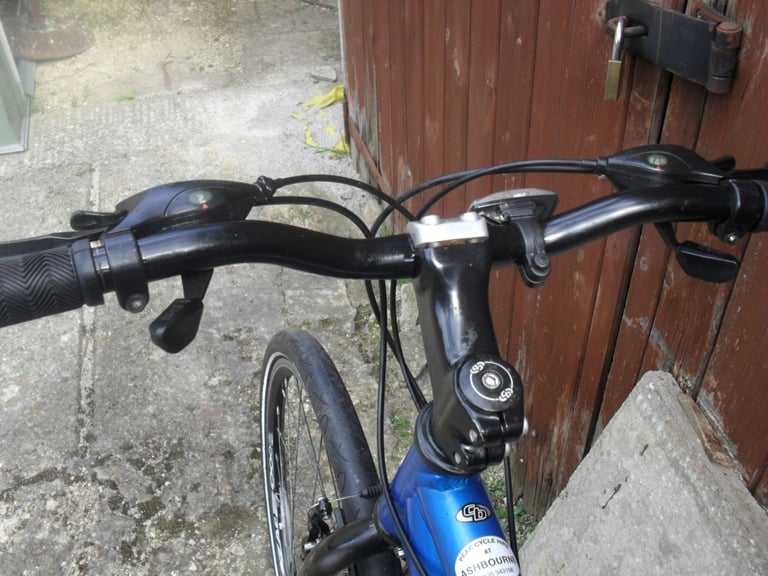 CLAUD BUTLER ADULT HYBRID BIKE.