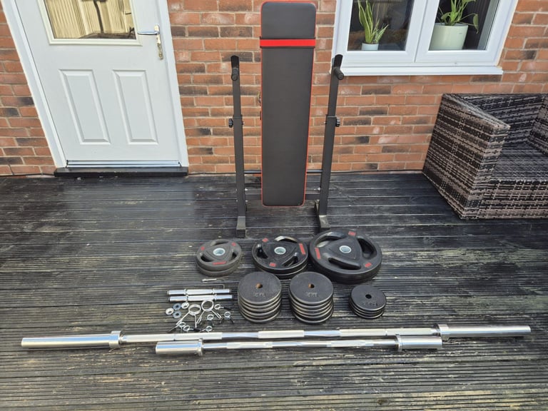 image for Weights bench, Olympic barbell and plates.
