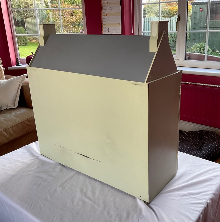 Handmade wooden dolls house with furniture and family