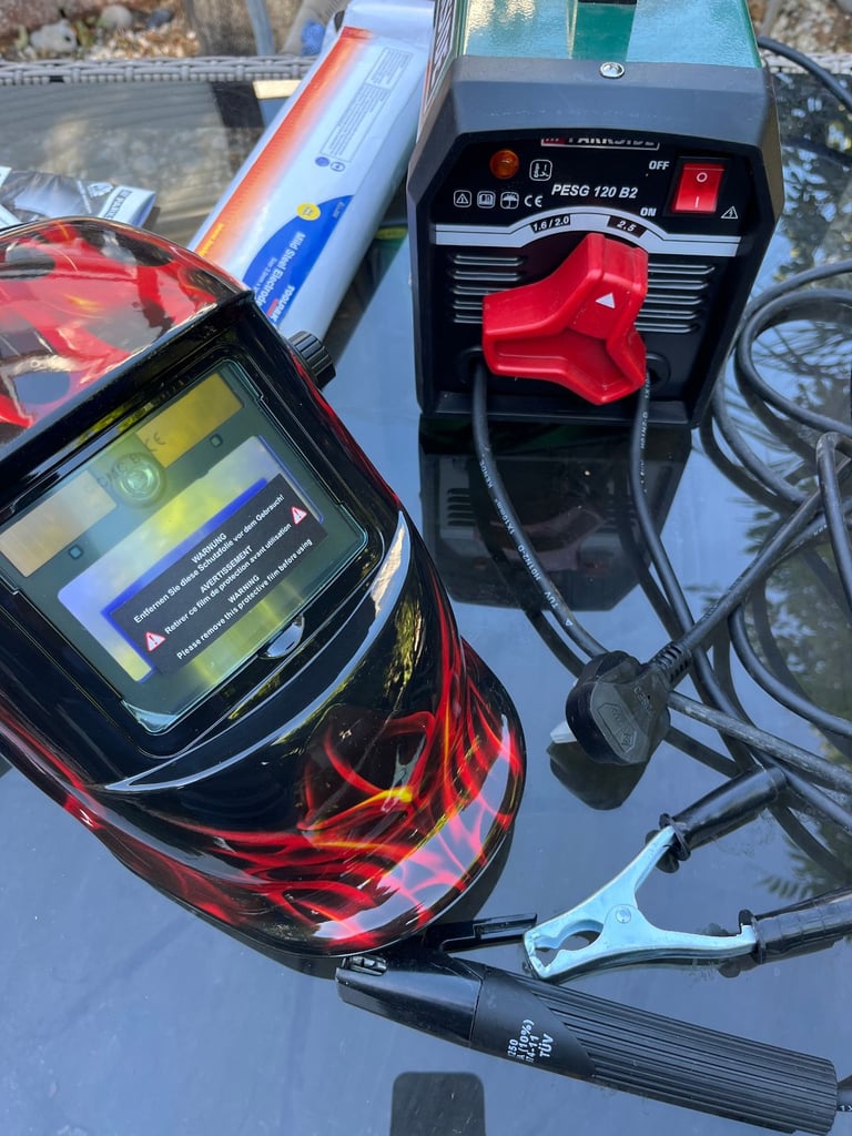 ARC WELDER + AUTO WELDING HELMET + BOX OF RODS