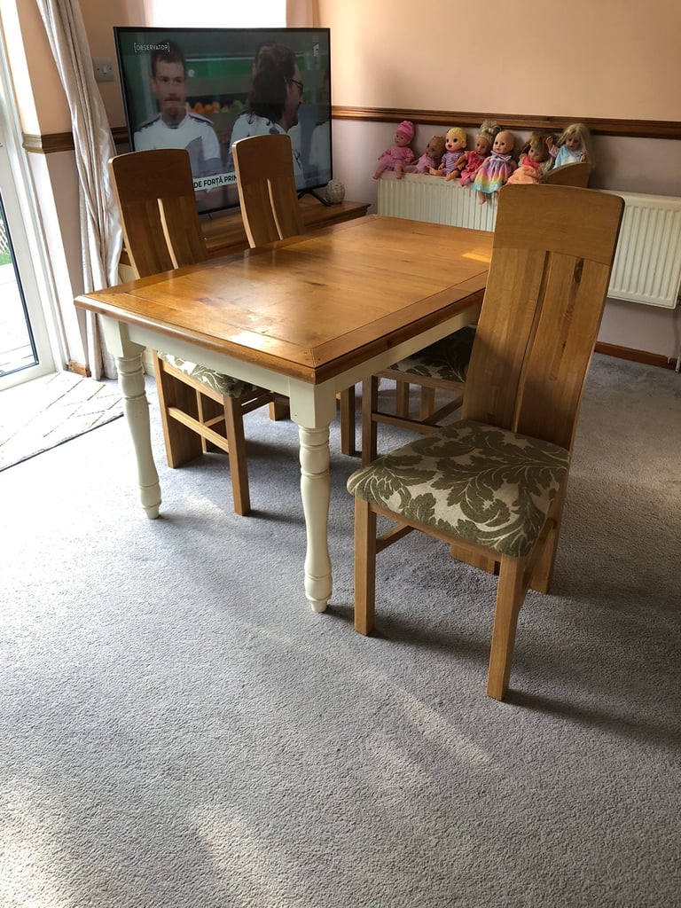 Oak extended dining table and four chairs 
