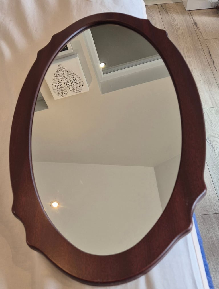 Oval mahogany mirror 