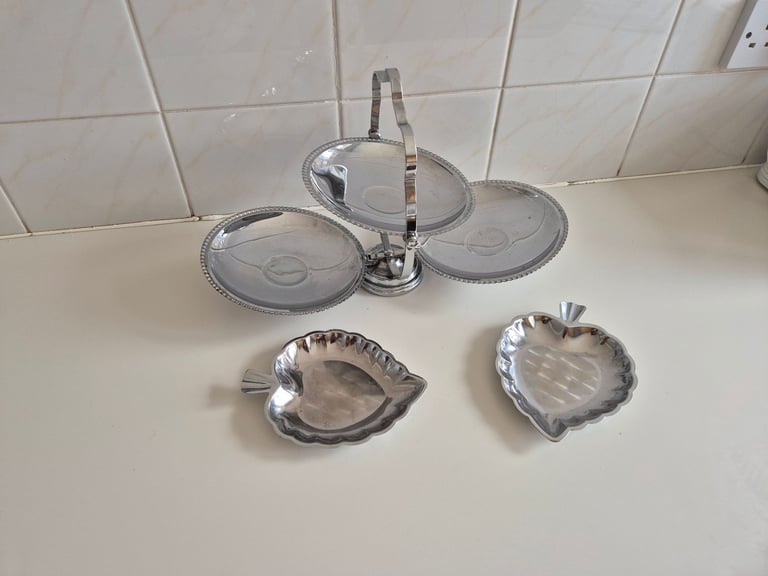 Folding Cake stand, chrome/tin. with 2 leaf shaped serving dishes. £10.00. lincoln