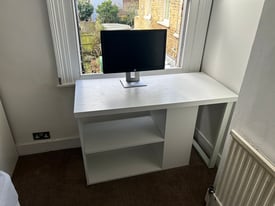 Desk with rotating storage shelves