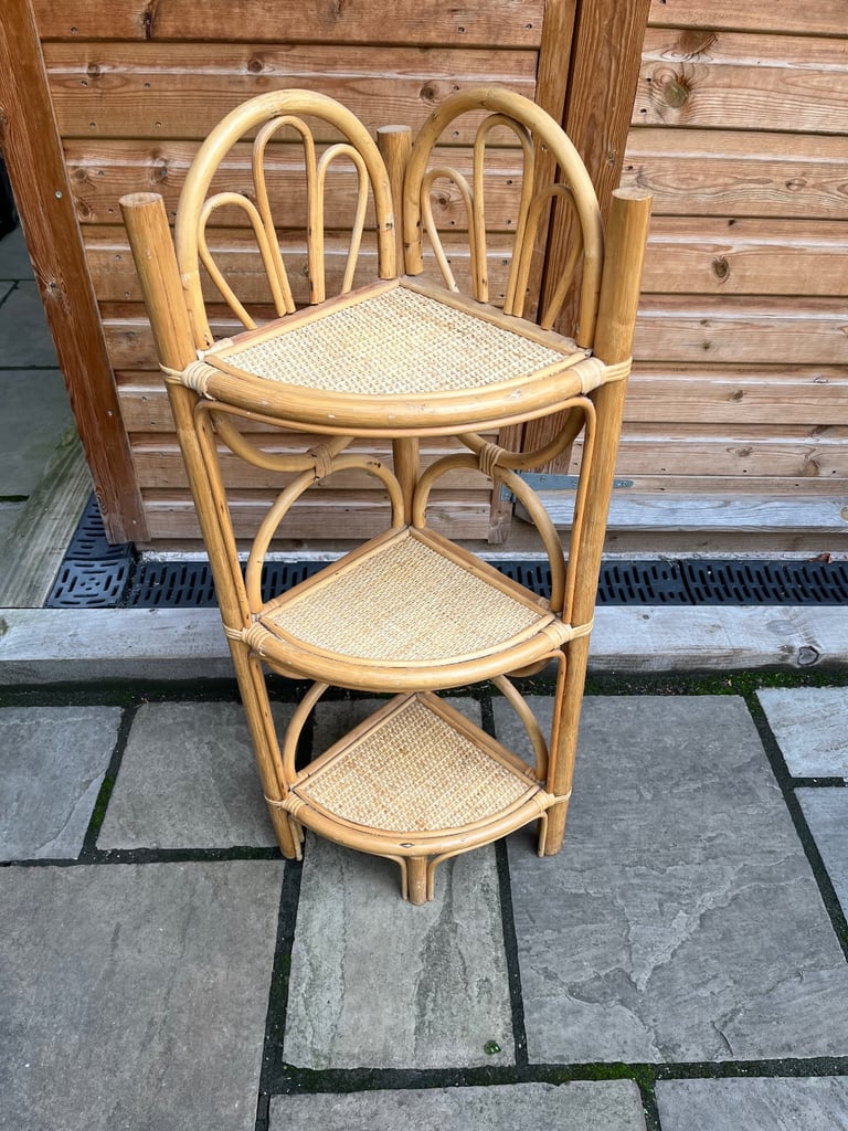 An attractive three shelf bamboo corner storage/ display stand