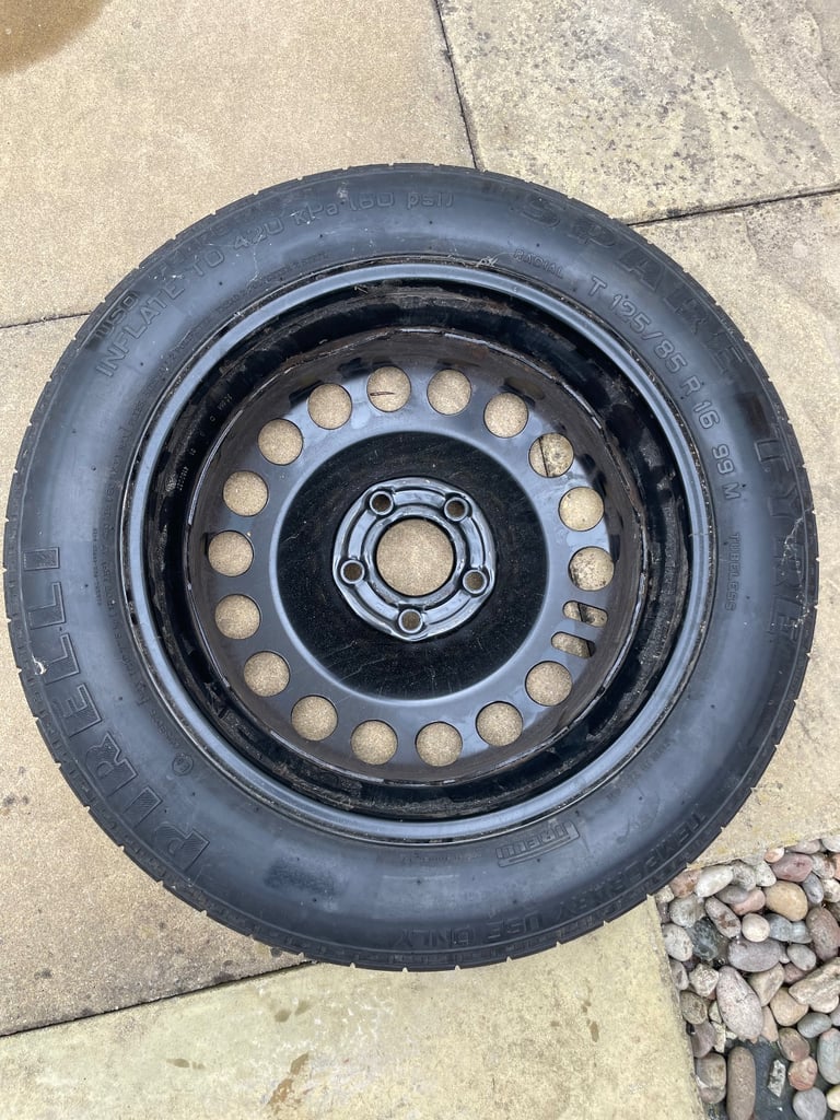 Spare tyre with toolkit