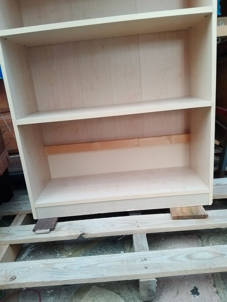 Very tall shelving unit in new condition spotlessly clean inside and out 