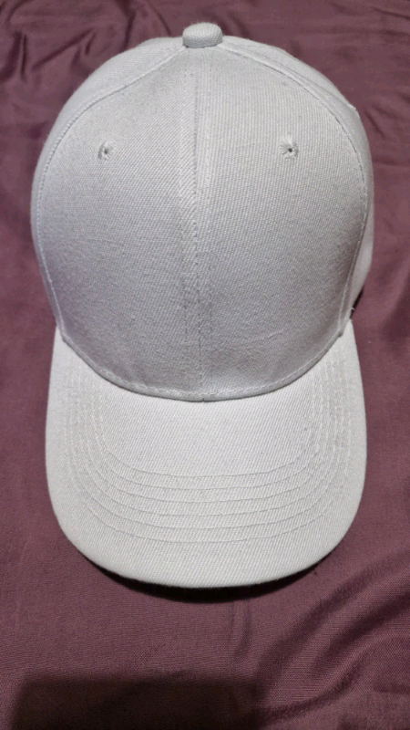 Brand new, white unisex duck-billed cap