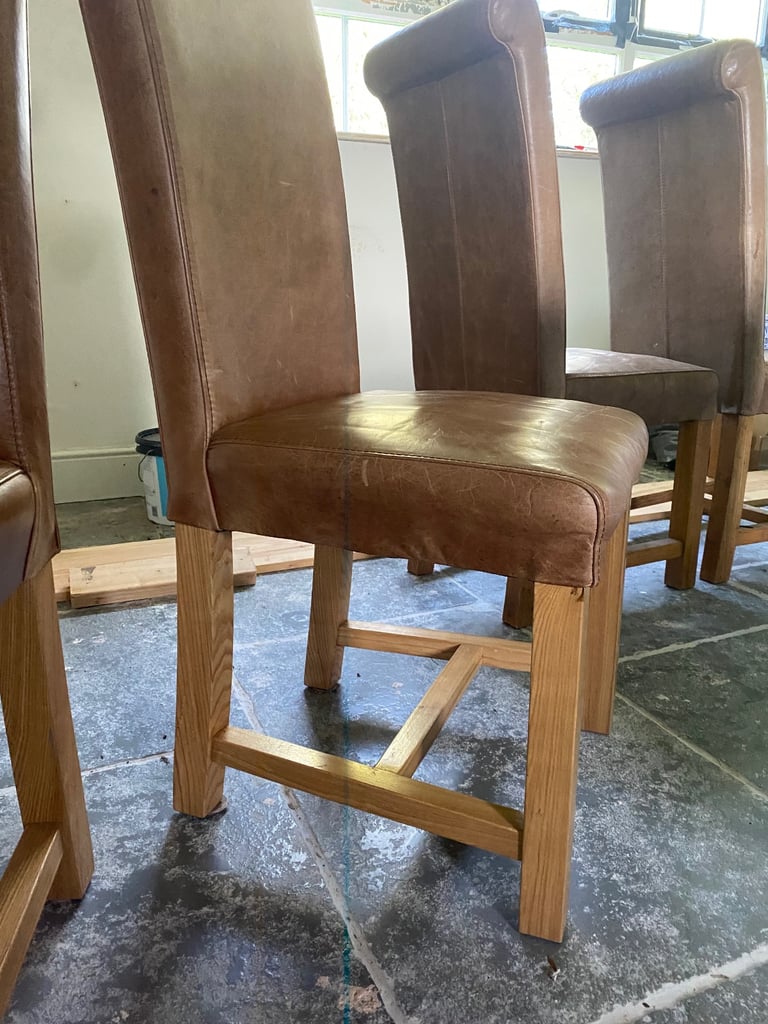4 Tan leather and wood dining chairs