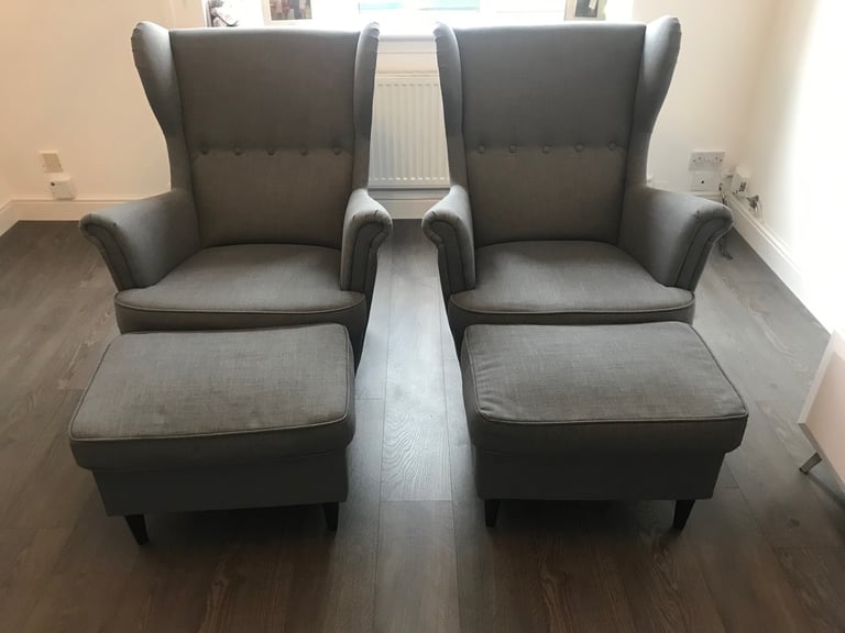 2 grey fabric high backed wing tipped chair with matching 2 grey fabric footstools, £140 for all 