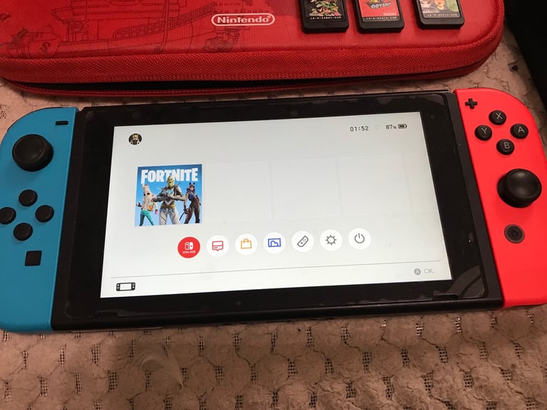 Nintendo Switch console with 3 games
