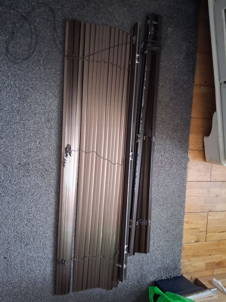 2. Brown Venetian blinds.