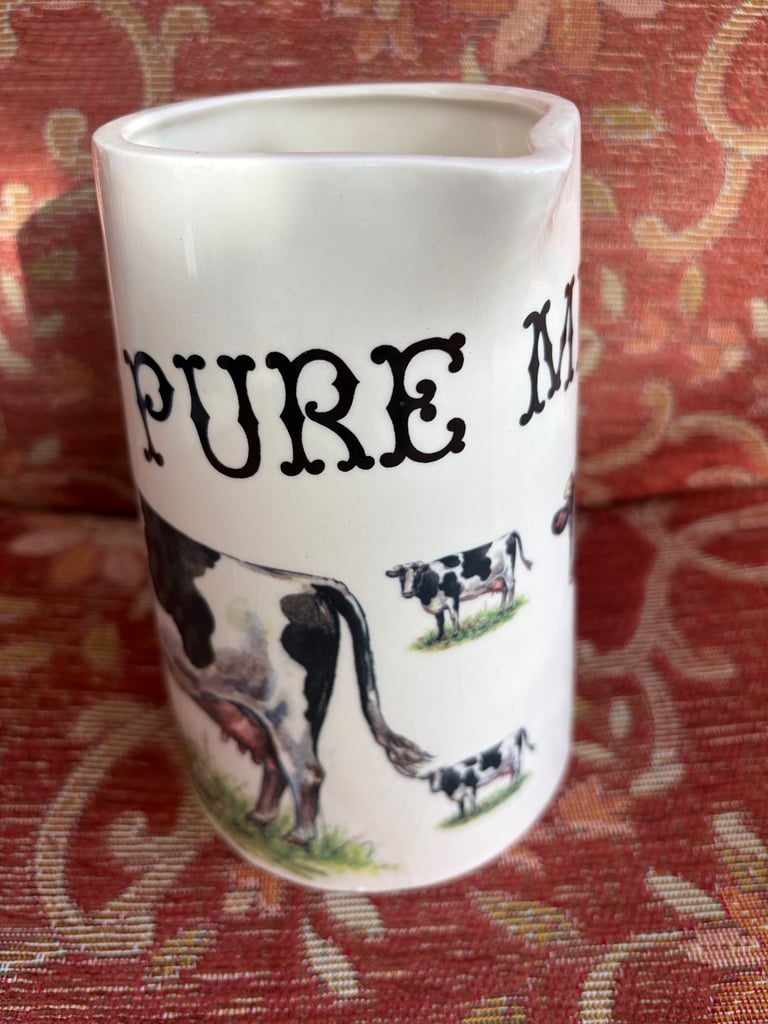 Ceramic milk jug with cow illustration