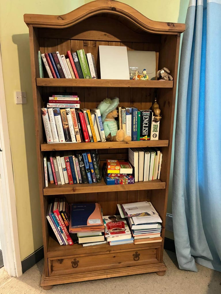 image for £50.  Light wooden bookcase with drawers at bottom