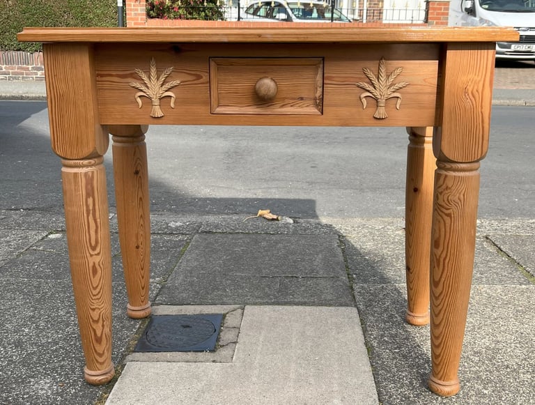 A CHUNKY SOLID PINE SIDE TABLE WITH WHEATSHEAF MOULDINGS