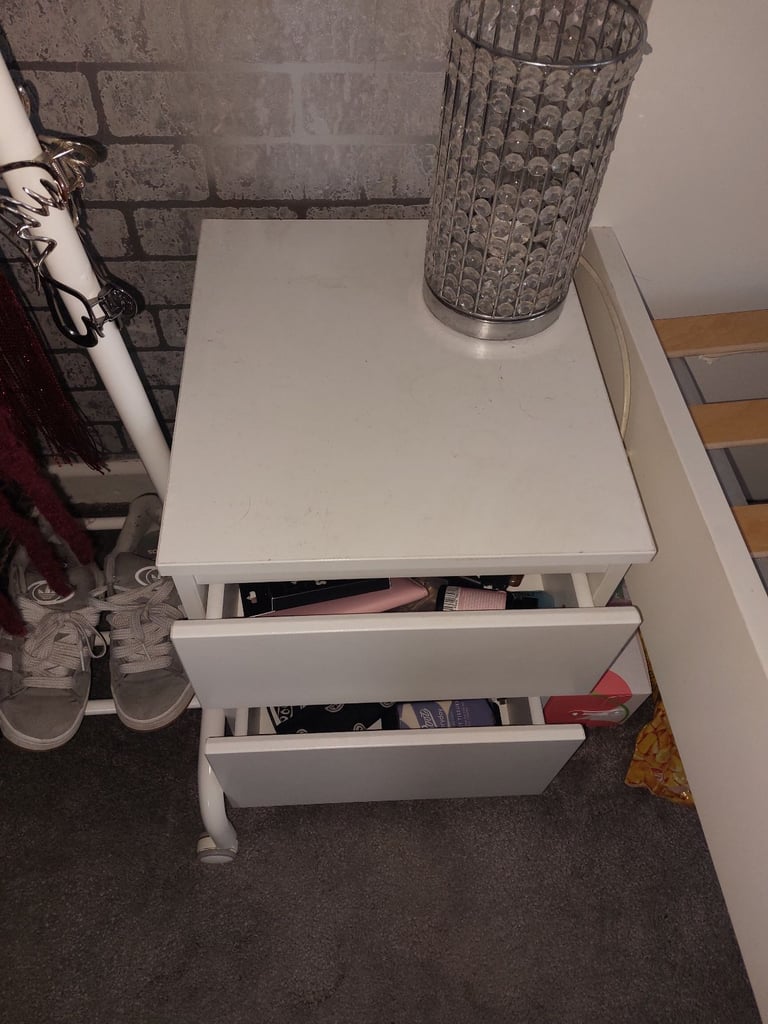 Single bed in white colour with bedside 