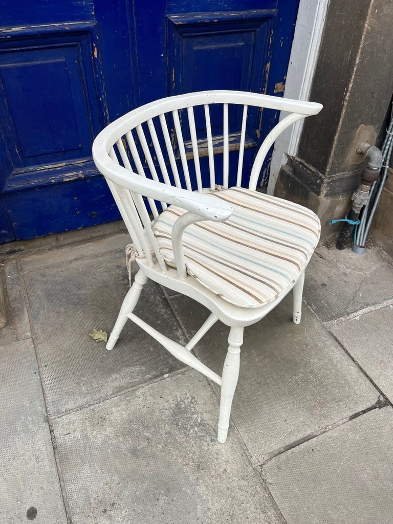 Vintage wooden chair , curved back detail . 
