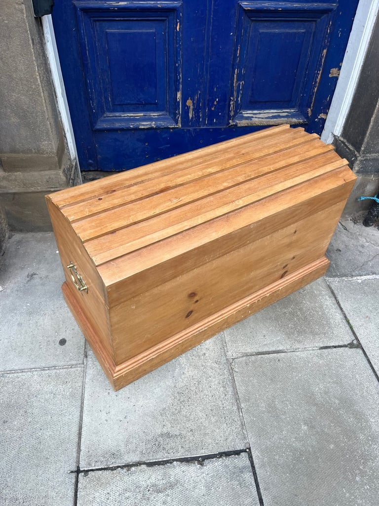 image for Pine Blanket Trunk with domed top . Has brass side handles .