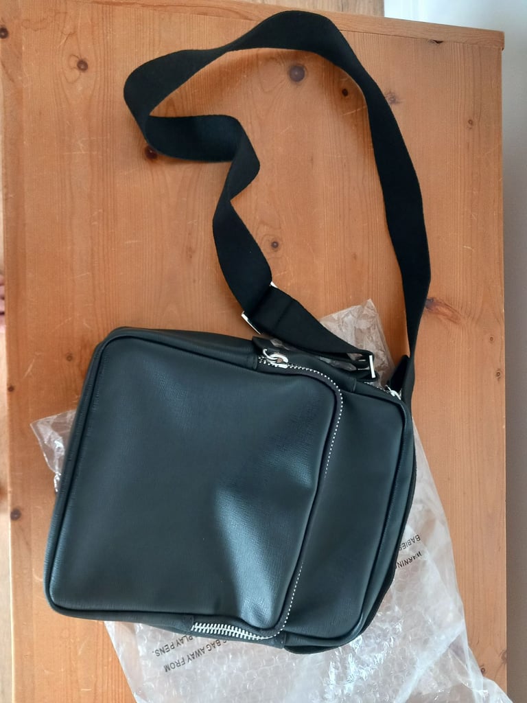 Two brand new M & S faux leather manbags. £18 each or £30 both