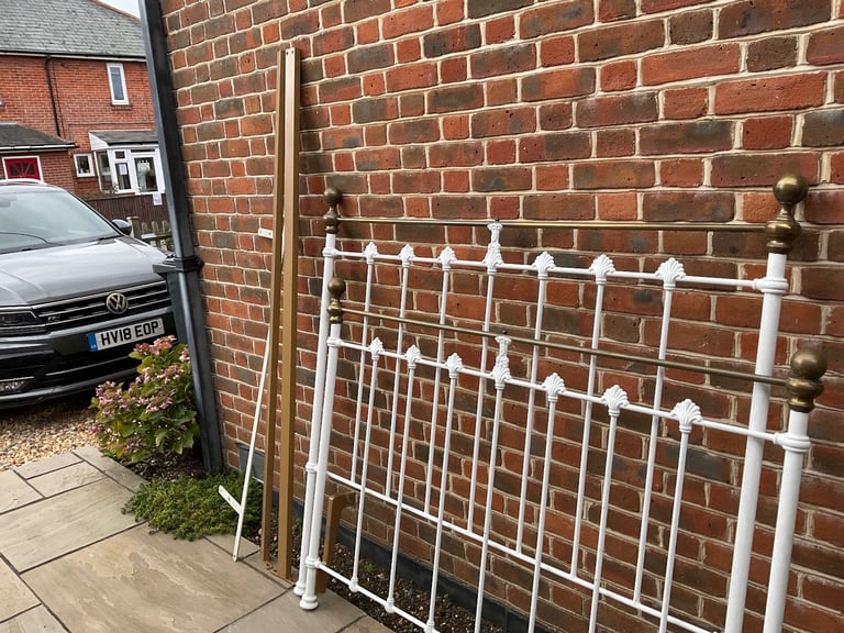 White wrought iron bedstead