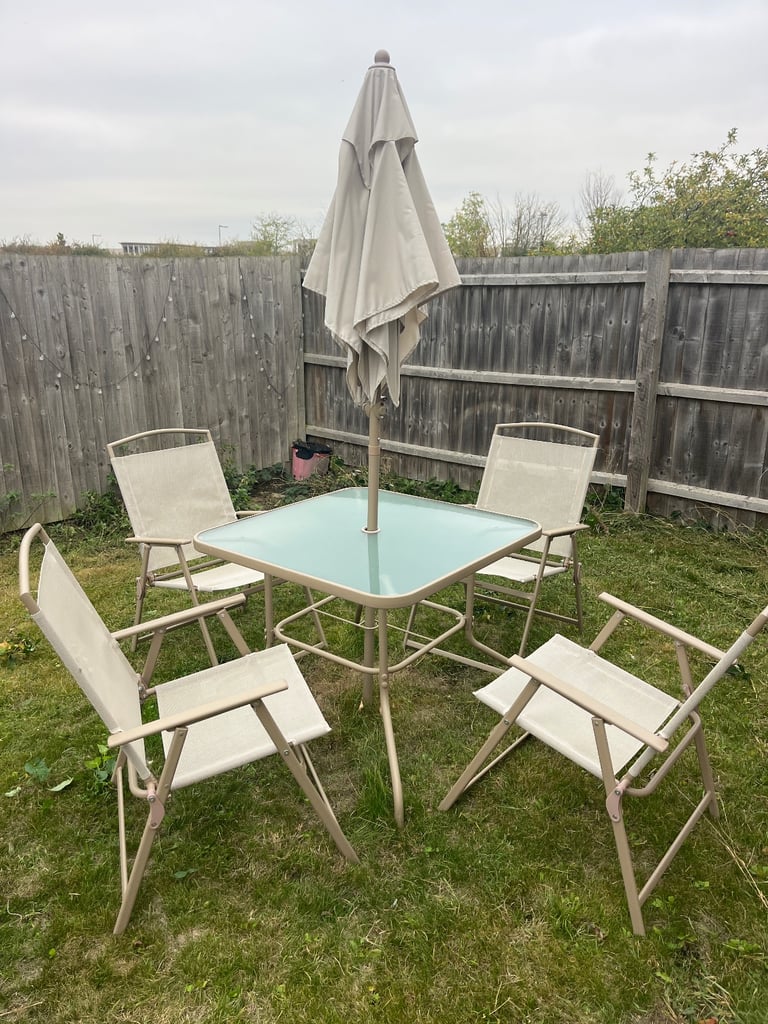 image for Table with umbrella and four chairs