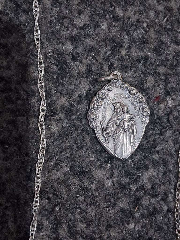 3 religious silver pendants and 2 silver chains 
