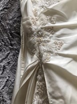 Ivory Corset style wedding dress with trail and lots of detail 
