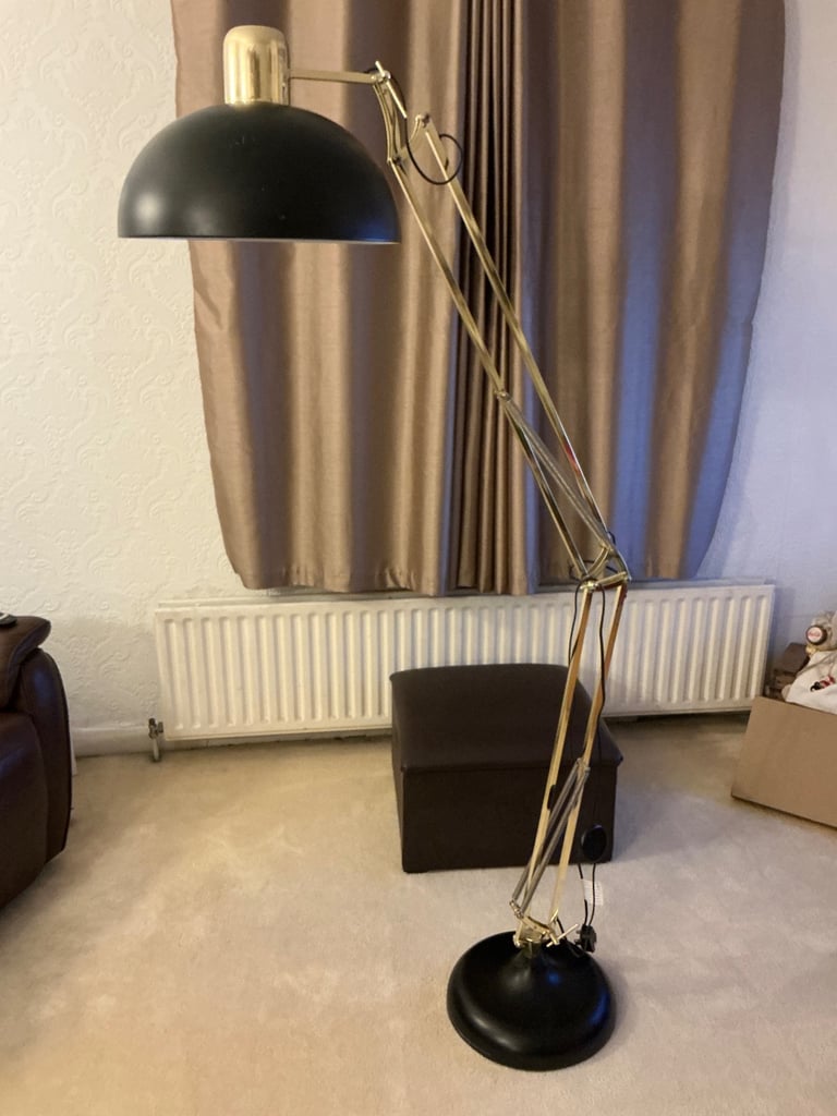 A tall angle poise lamp