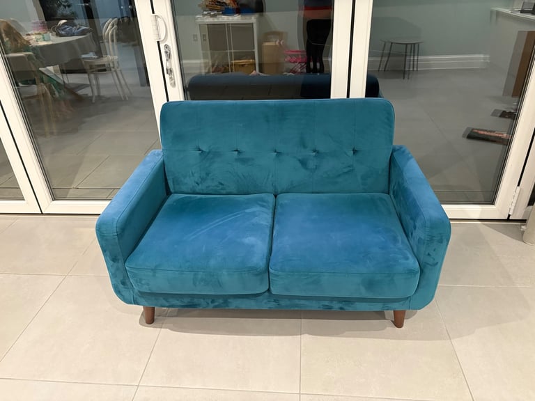 Teal green sofa