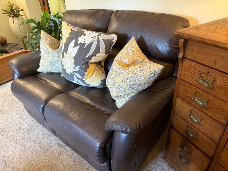 Leather two seater reclining sofa