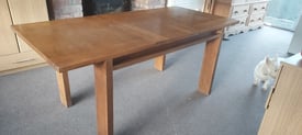 Solid oak extendable dining table.