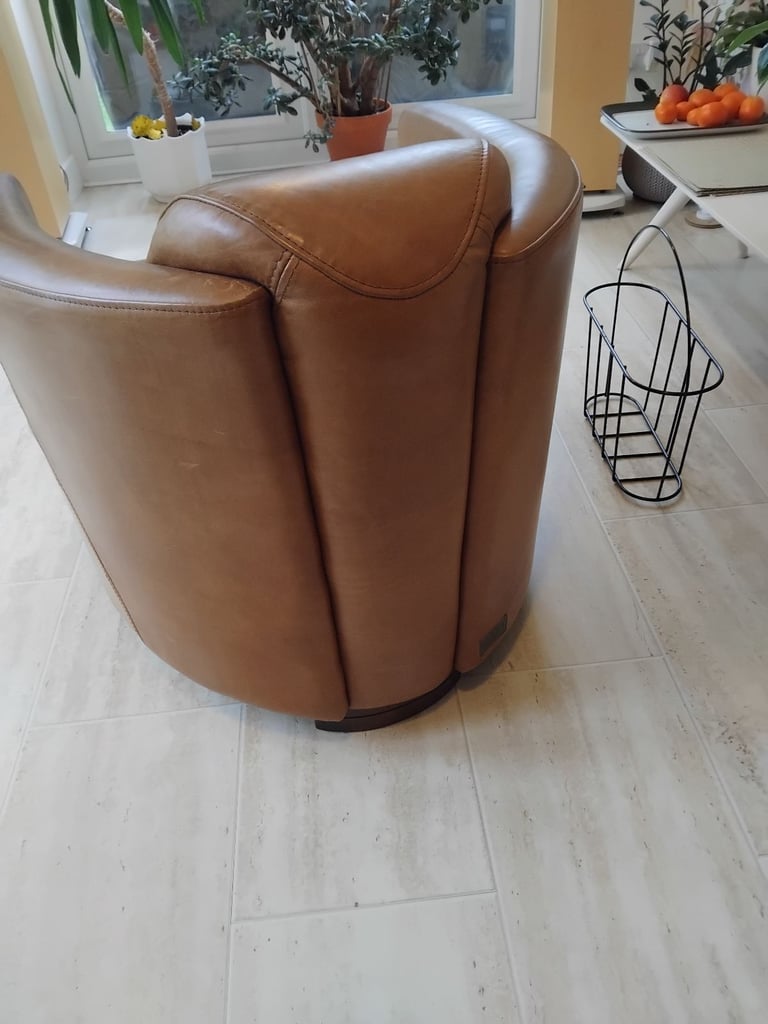 Pair of Halo Rocket/Aviator chairs in Old Saddle Nut leather. Two chairs.
