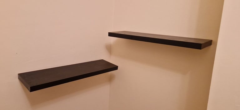 2 black floating shelves