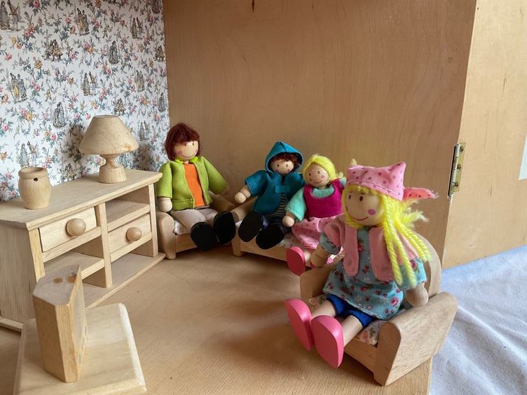 Handmade wooden dolls house with furniture and family