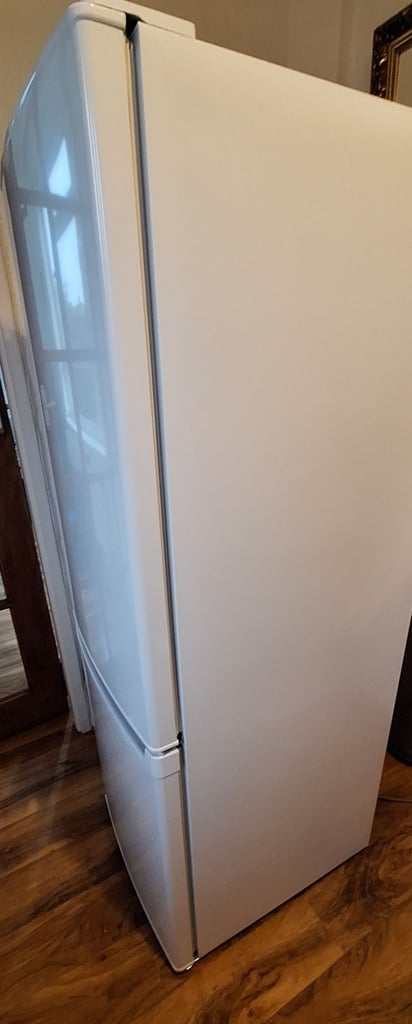 LOGIK fridge freezer size  H 142cm like new one year old 