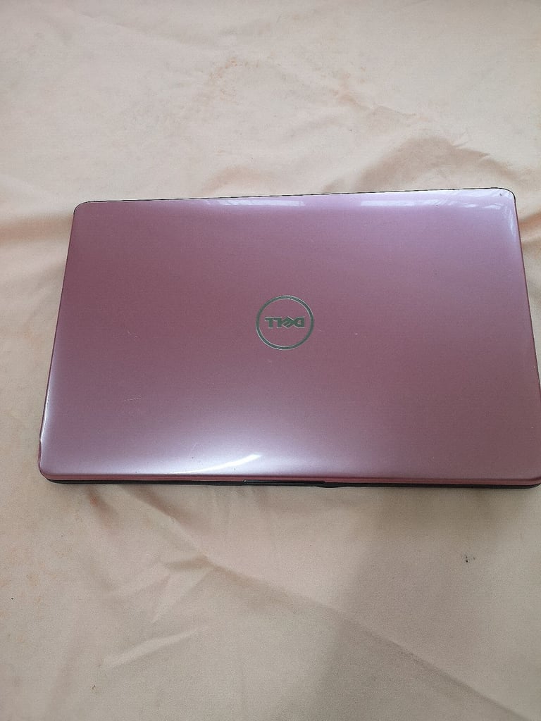 Dell Inspiron Laptop on Windows 10 with pink colour lid. . Pink colour. 