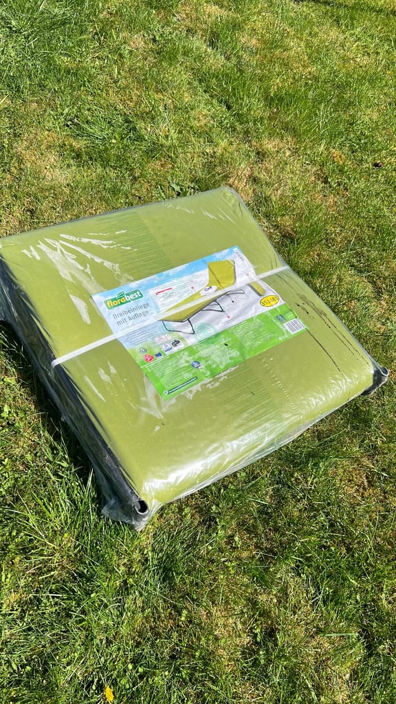 Fold away sun bed with cushion brand new and sealed. 