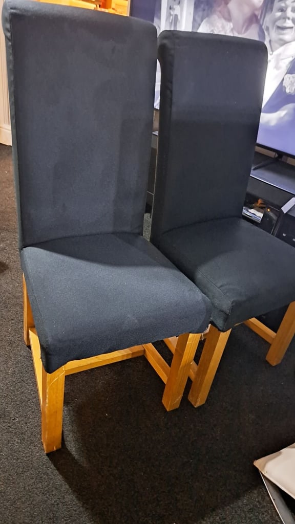image for Two black solid chairs. 