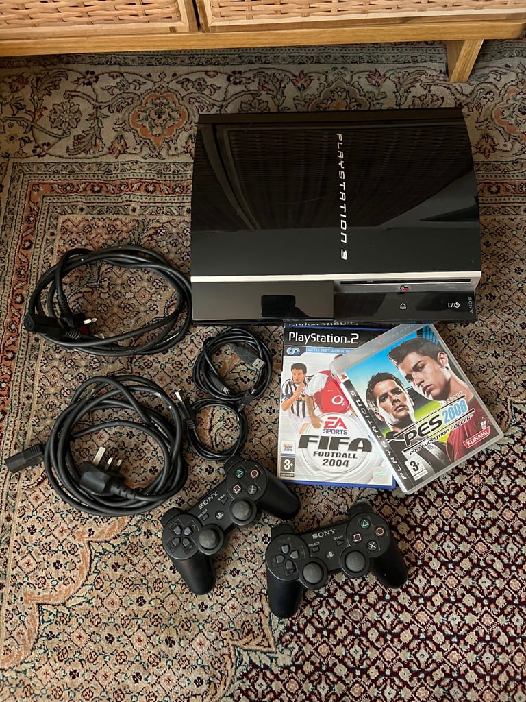 PS3 with wires, 2 controllers and 2 games. 
